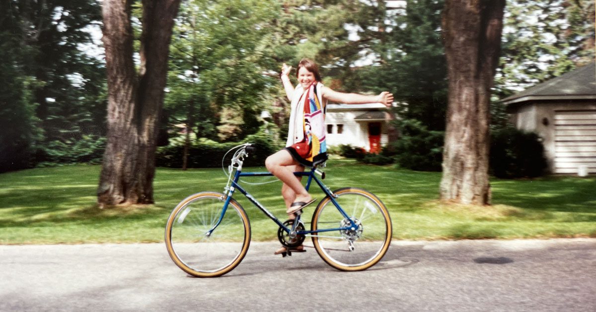 Spring Creative Inc's founder Fern Sabo on a bicycle